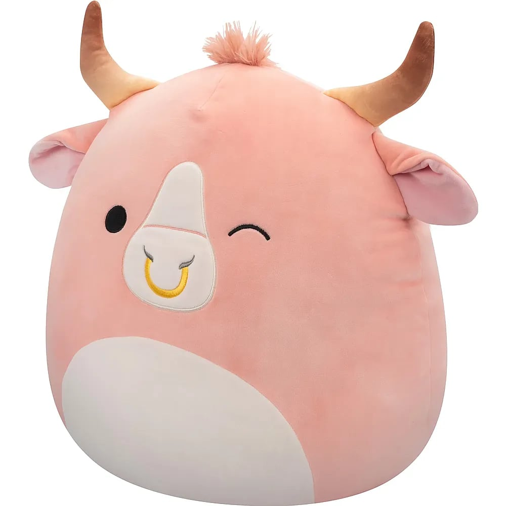 Une vaches en peluche rose avec des cornes brunes, un ventre blanc et un anneau nasal doré.