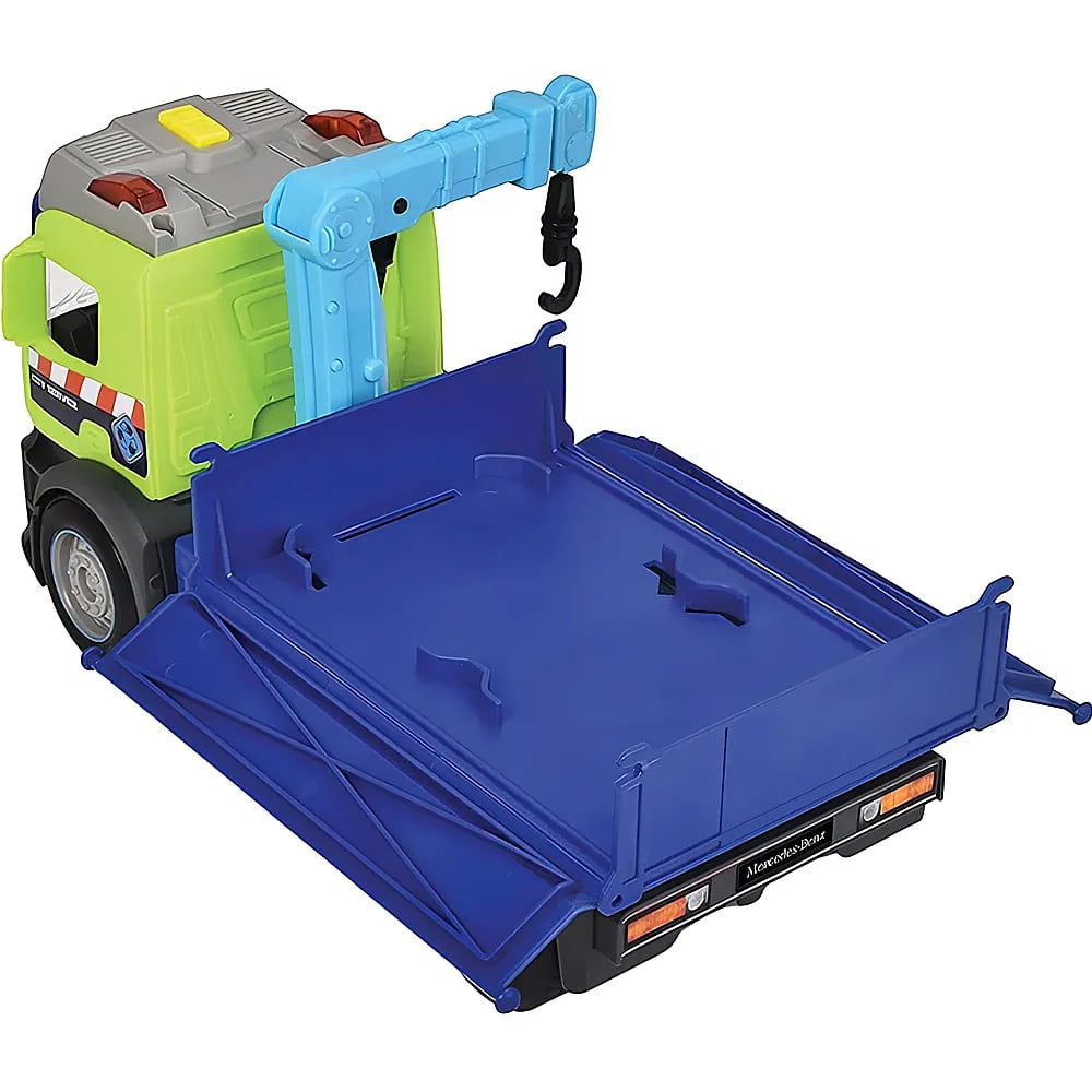 Ein gelb-grüner Spielzeuglastwagen mit blauer Ladefläche und einem blauen Kran.