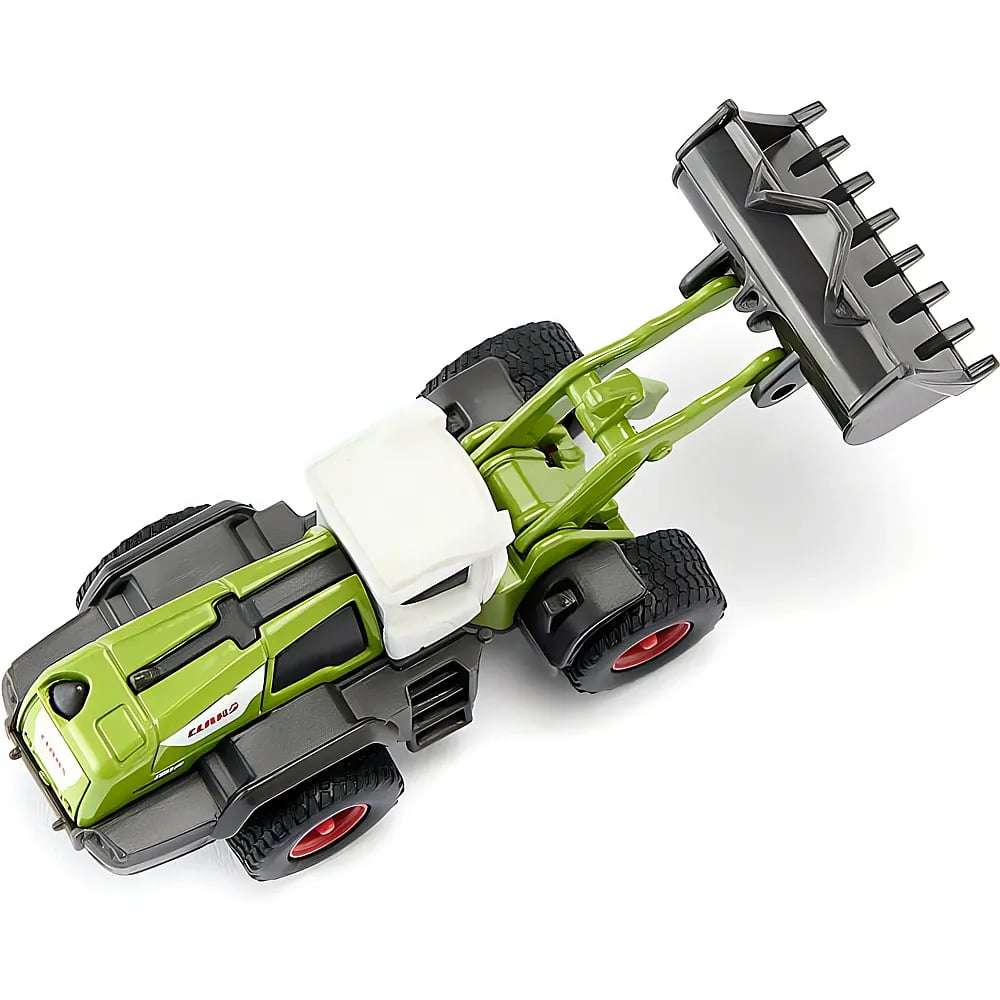 Ein grüner Spielzeugtraktor mit weißer Kabine und großer schwarzer Frontschaufel auf weißem Hintergrund.