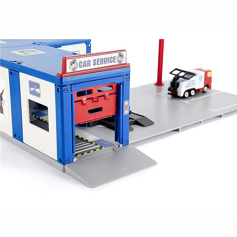 Eine Spielzeug-Autowerkstatt in Blau, Weiß und Rot mit einer Rampe und einem kleinen Lkw draußen.