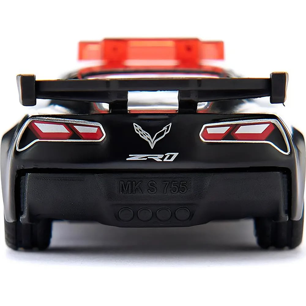 Vue arrière d'une voiture jouet noire avec un aileron rouge et le texte MK S 755.