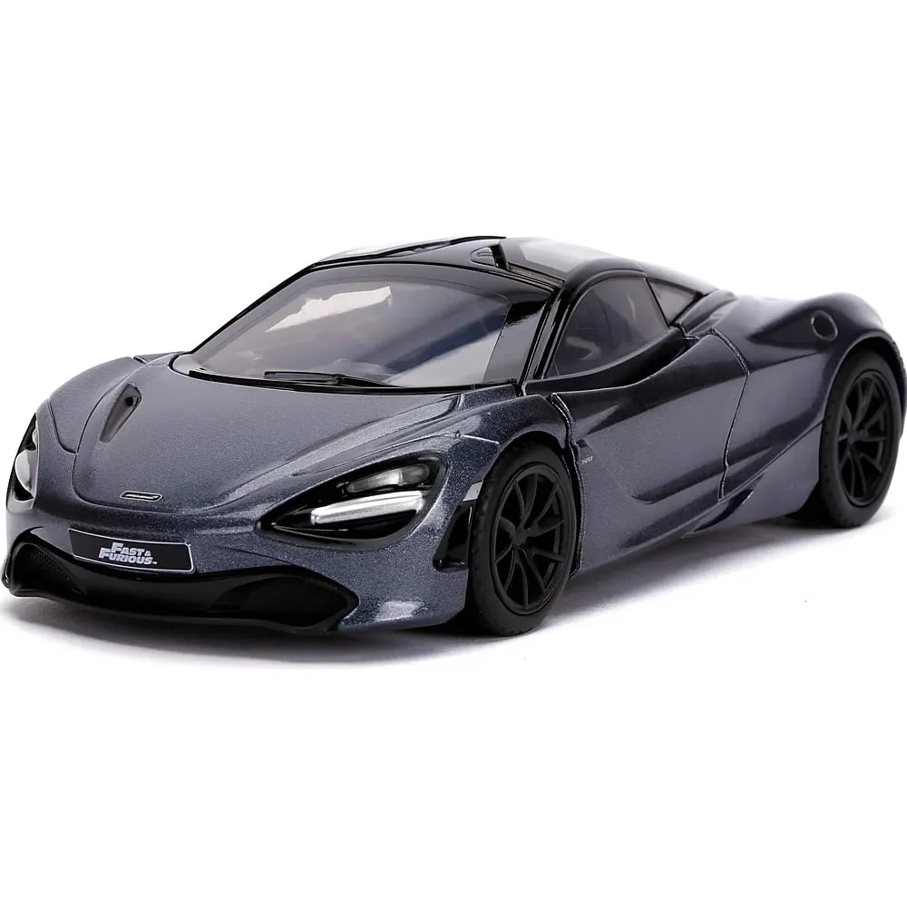 Un'auto sportiva giocattolo grigio scuro su sfondo bianco, vista di fronte.