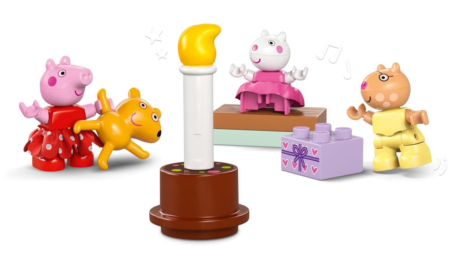 Lego Duplo Peppa Pig Figuren um eine große Kerze und Geschenkbox.