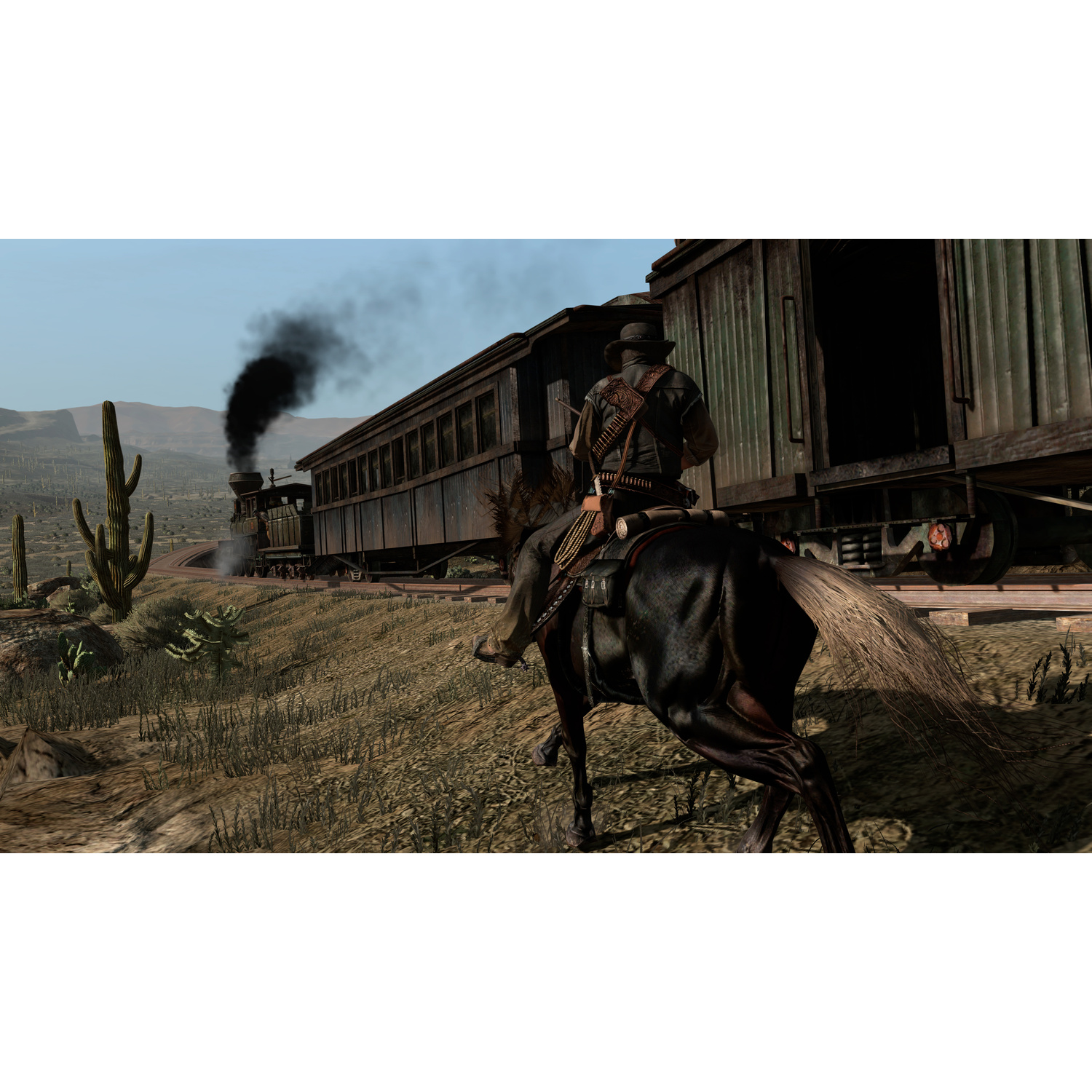 Un cowboy cavalca un cavallo nero accanto a un treno a vapore in un paesaggio desertico.
