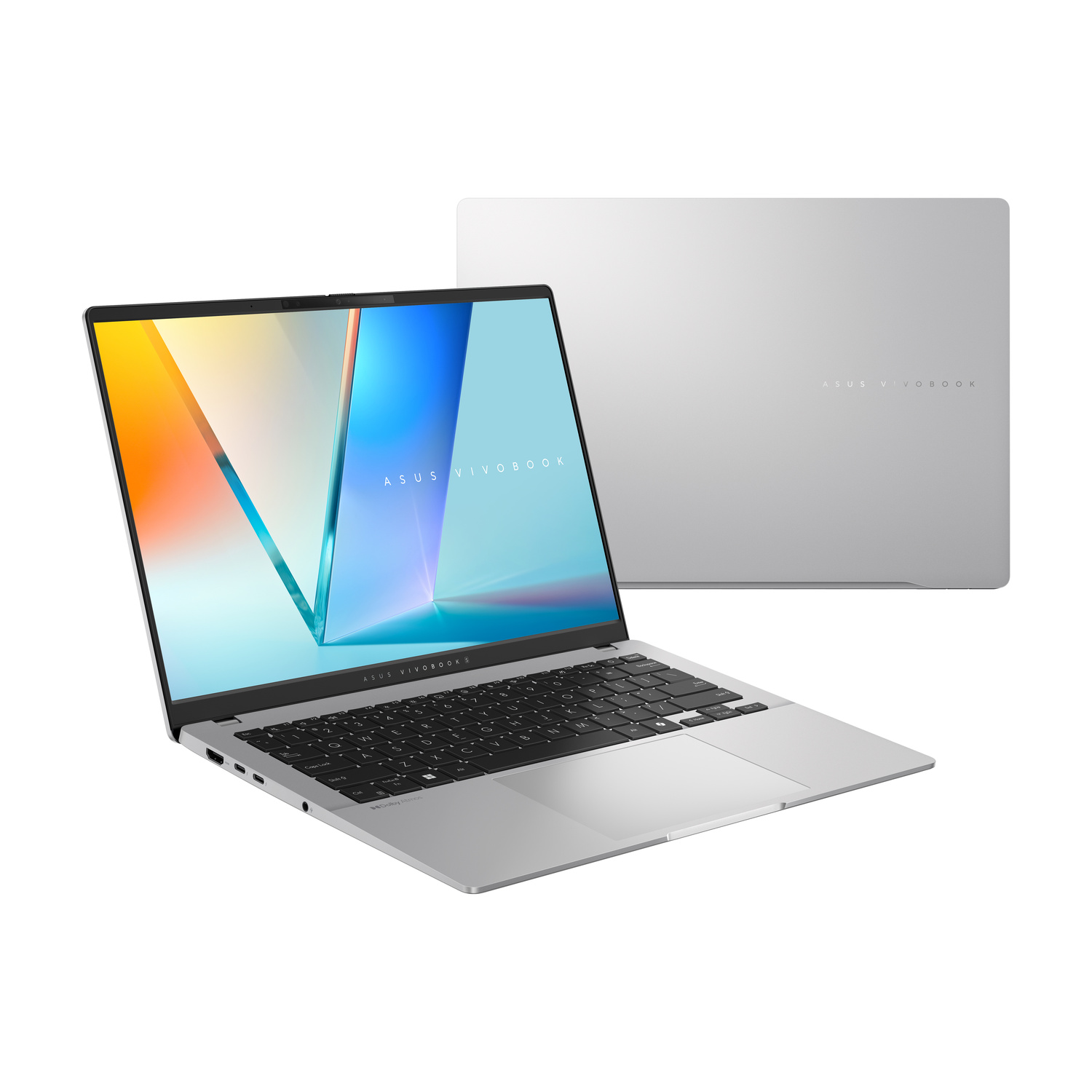 Laptop ASUS Vivobook argento aperto con schermo colorato e chiuso sullo sfondo.