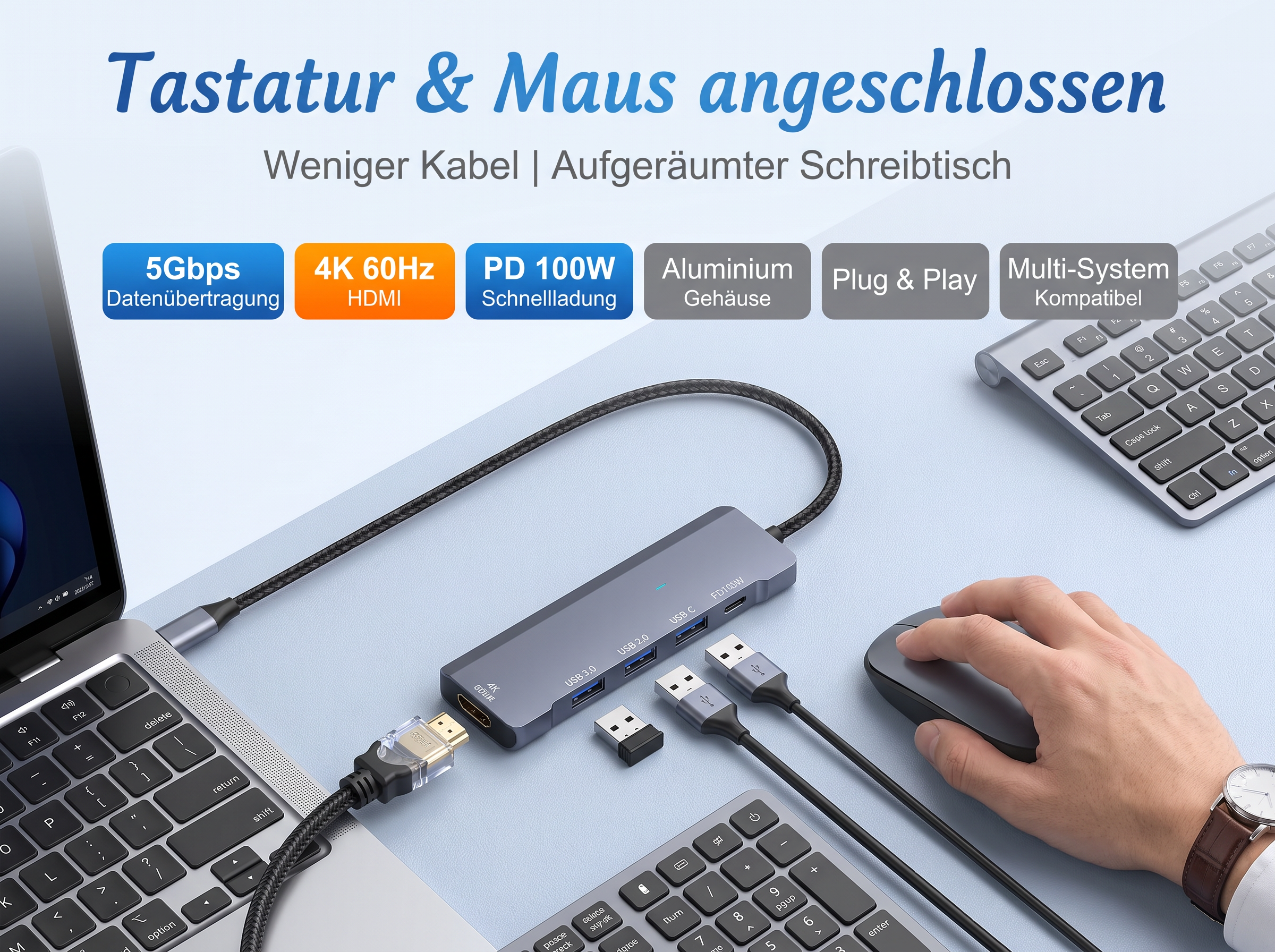 Grauer USB-C Hub angeschlossen an Laptop mit Kabeln, Maus und Tastatur auf hellem Tisch.