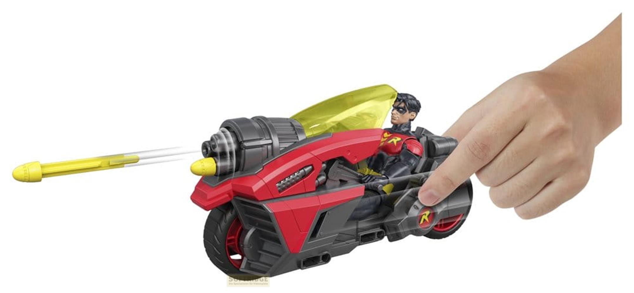 Eine Hand schießt ein gelbes Geschoss von einem roten Spielzeugmotorrad mit Robin-Figur ab.