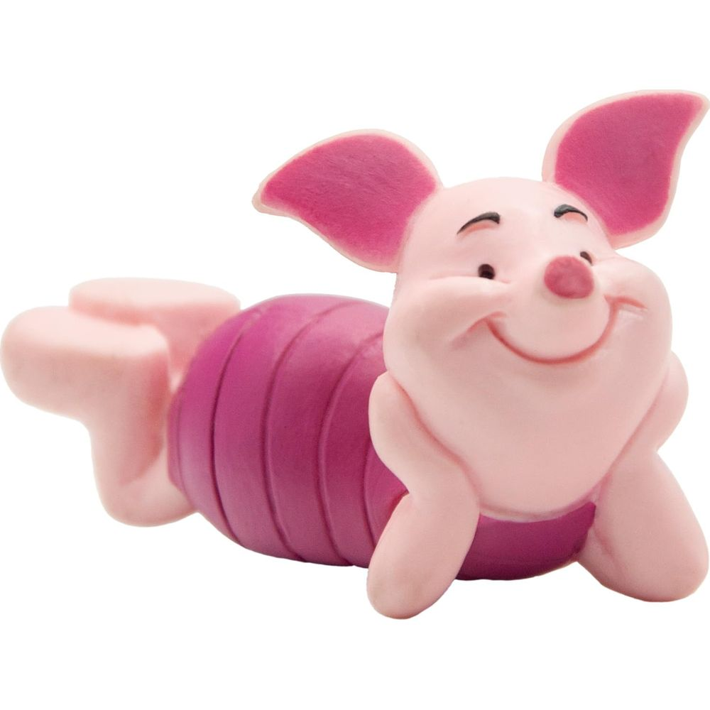Eine rosa Ferkel-Figur liegt glücklich auf dem Bauch mit dunklen Streifen.