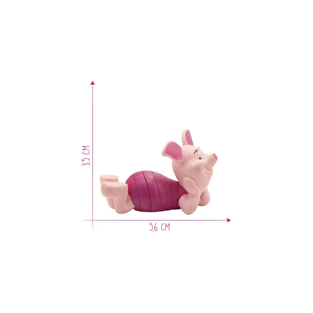 Eine rosa Ferkel-Figur liegt, mit einer Höhe von 3,5 cm und einer Länge von 5,6 cm.