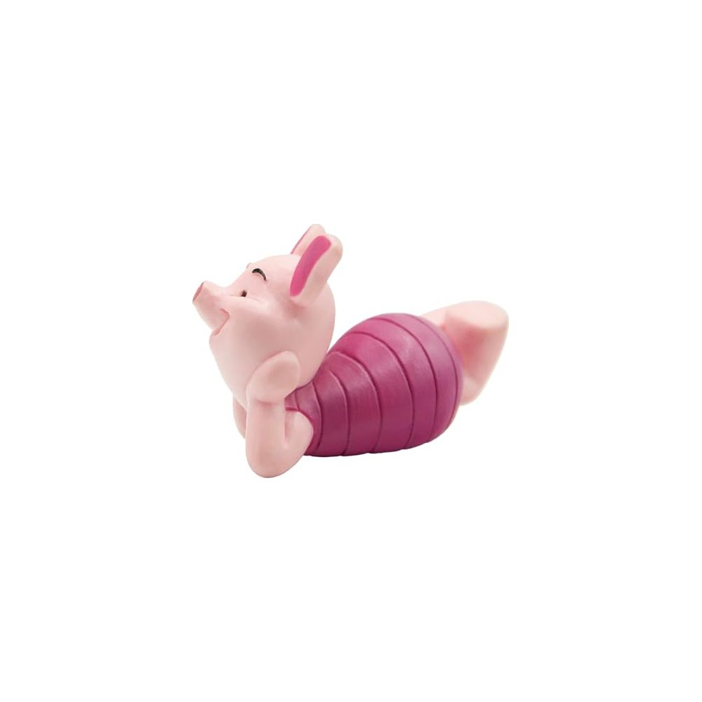Eine kleine rosa Ferkel-Figur liegt auf dem Bauch und trägt ein dunkelrosa gestreiftes Hemd.