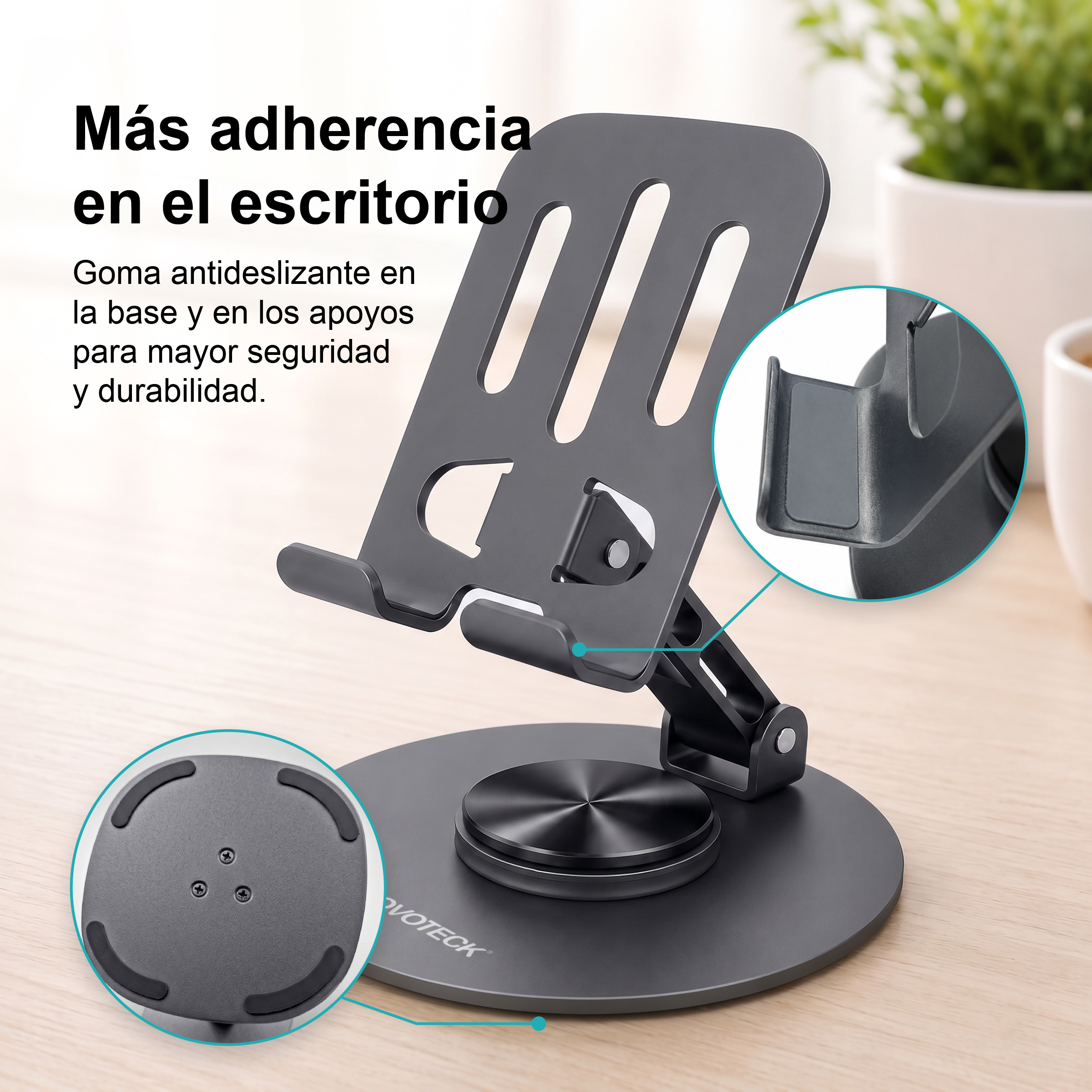 Soporte de teléfono gris ajustable con base redonda, almohadillas de goma y texto en español.