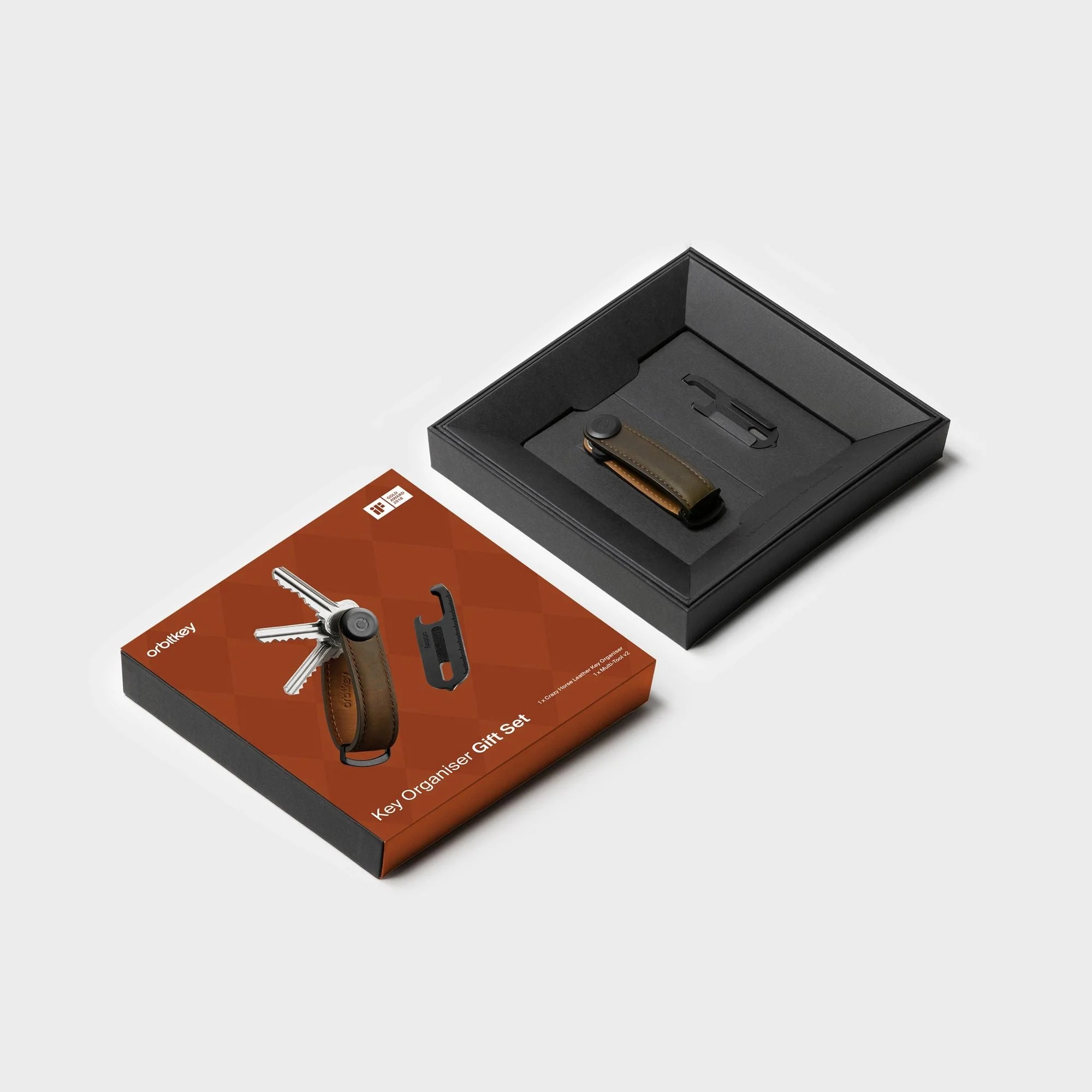 Zestaw prezentowy Orbitkey w otwartym czarnym pudełku i z ozdobnym opakowaniem.