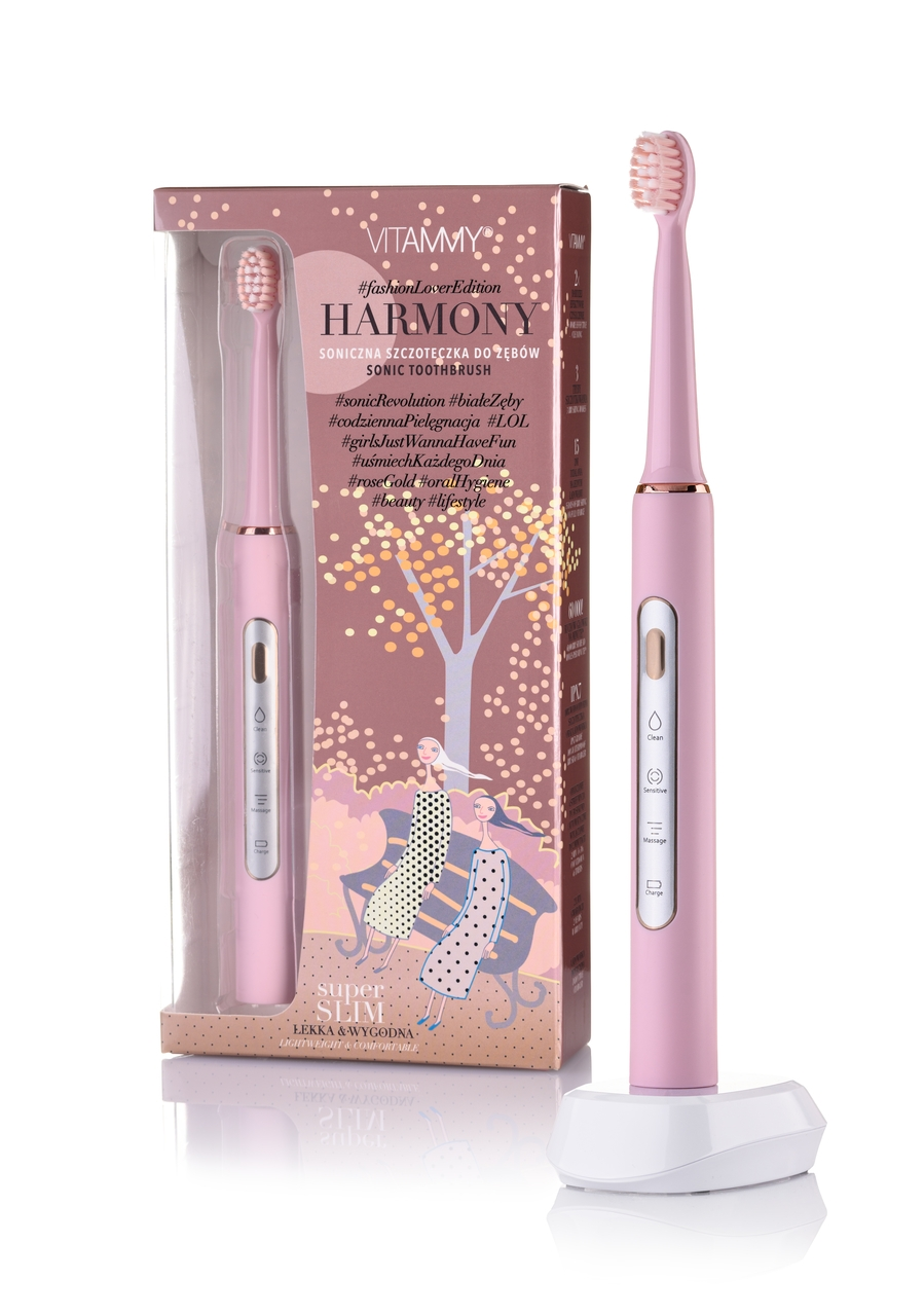 Uno spazzolino sonico rosa accanto alla sua scatola di imballaggio decorativa rosa e bianca.