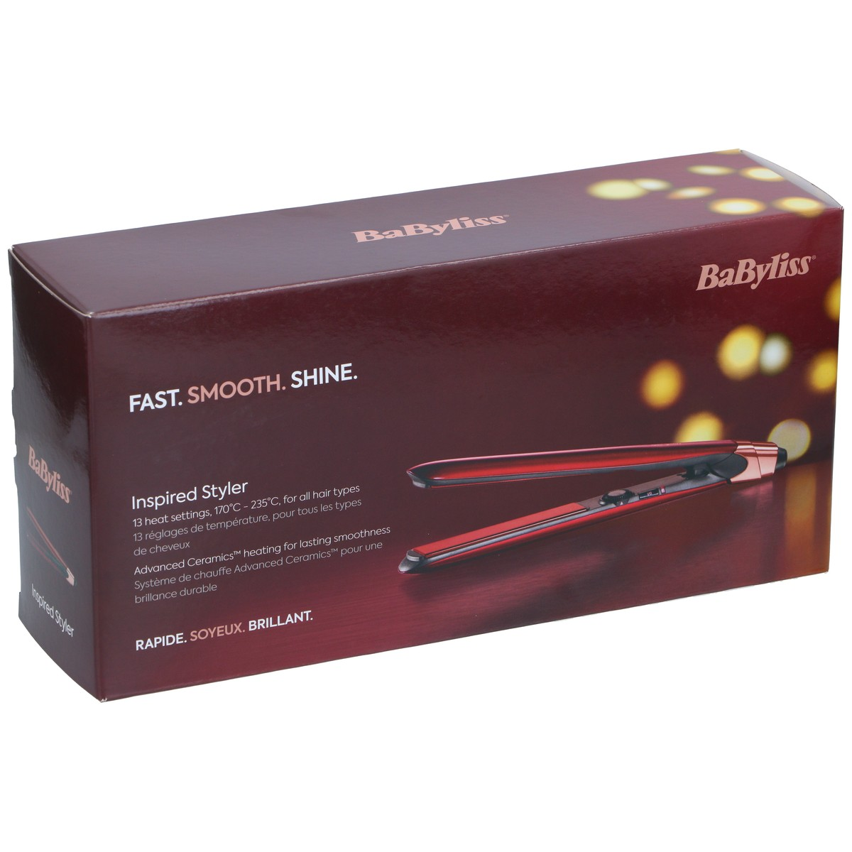 Una scatola rosso scuro di piastra per capelli BaByliss con luci dorate e testo.