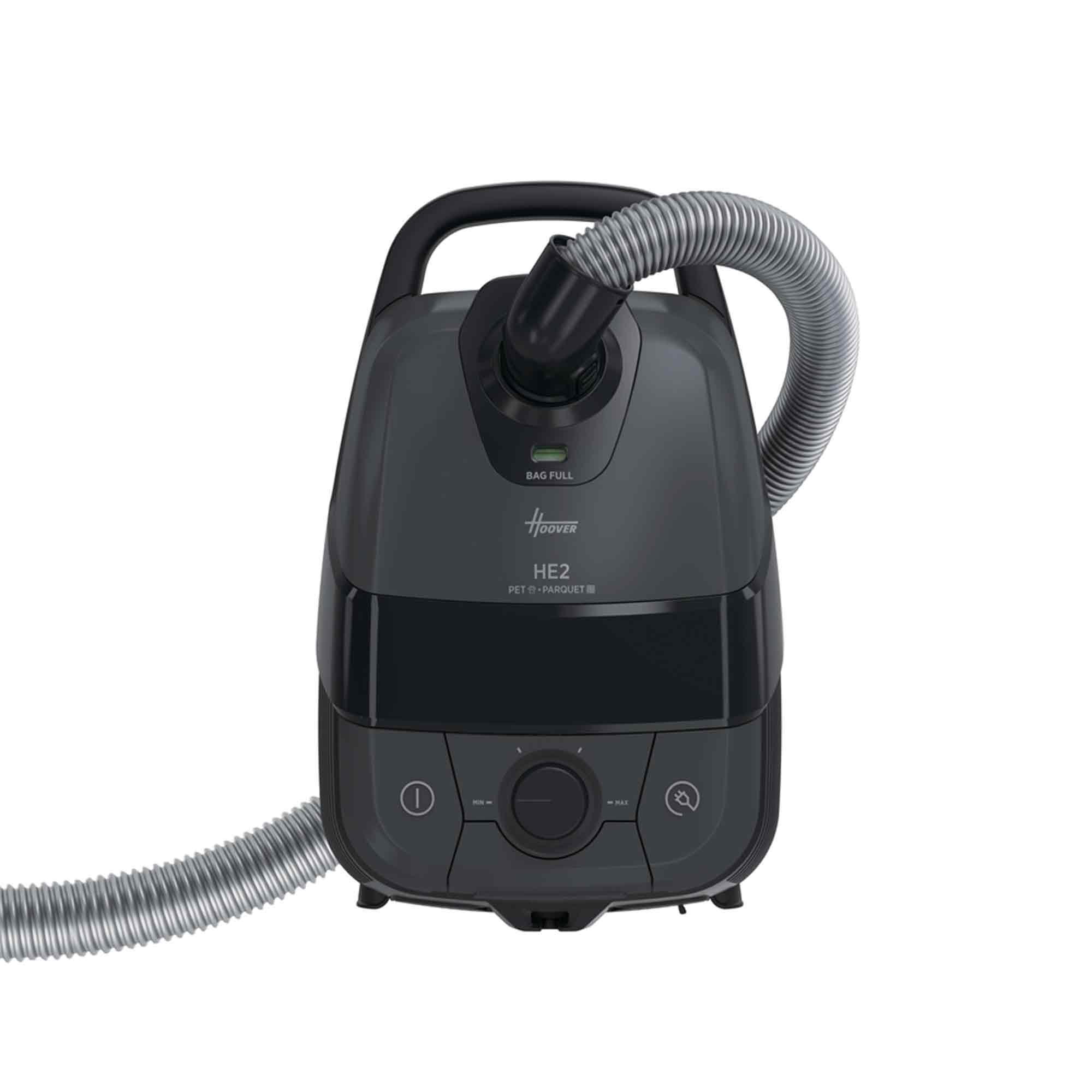 Dunkelgrauer Hoover HE2 Staubsauger mit Schlauch und Drehknopf auf weißem Hintergrund.