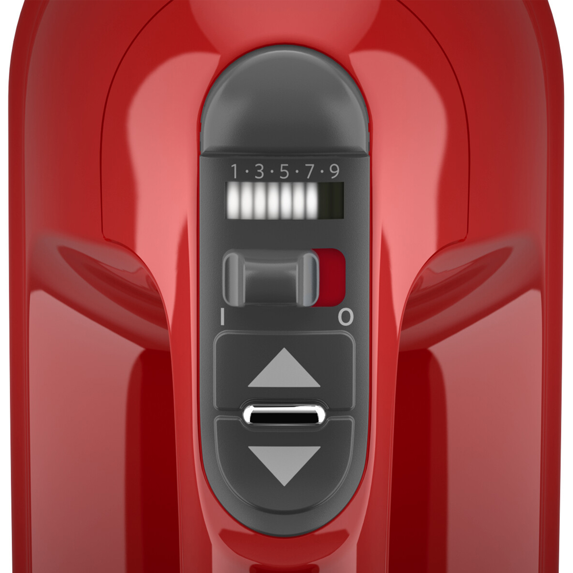 Close-up of the speed control and buttons on a red hand mixer.