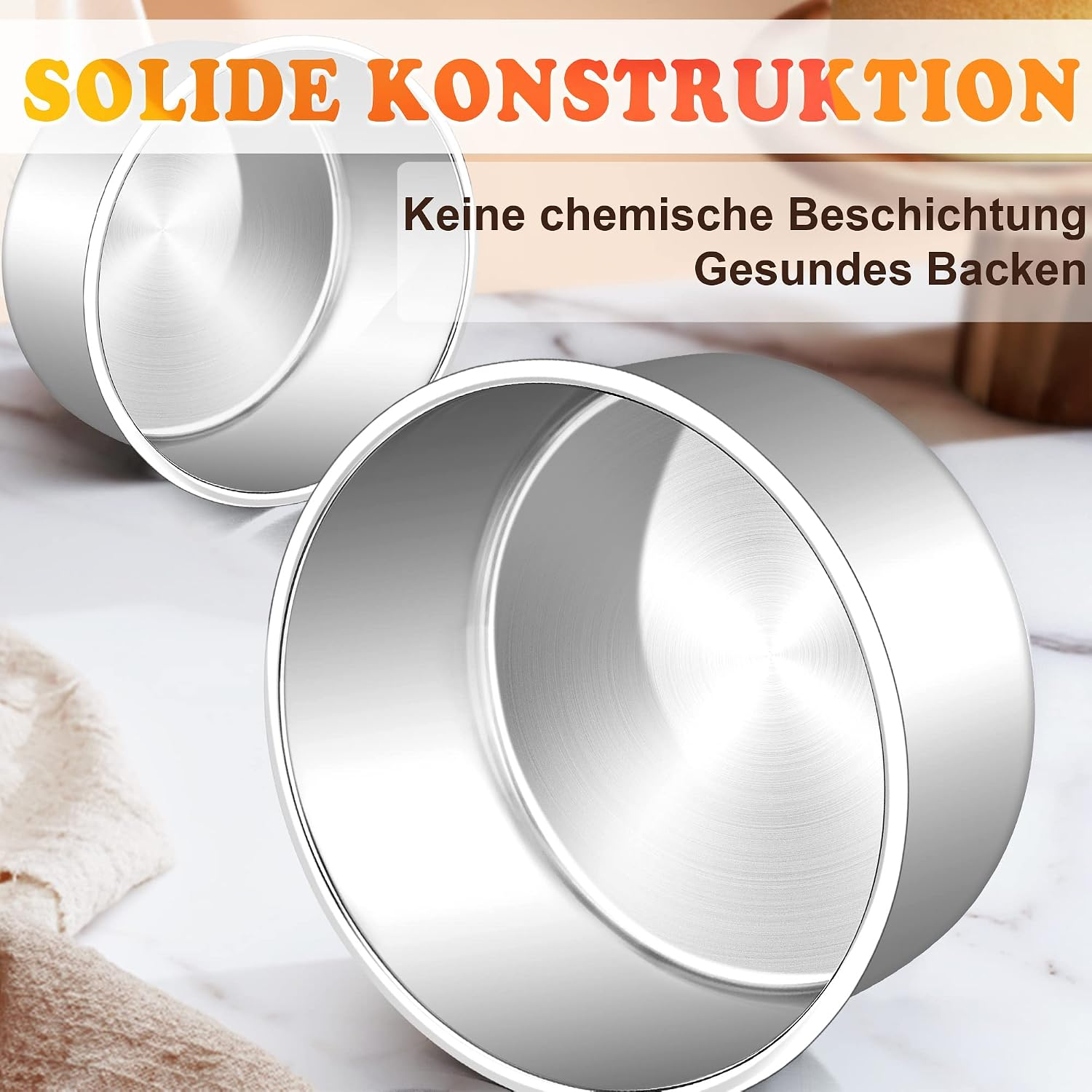 Zwei Edelstahltortenformen auf Marmor mit deutschem Werbetext.