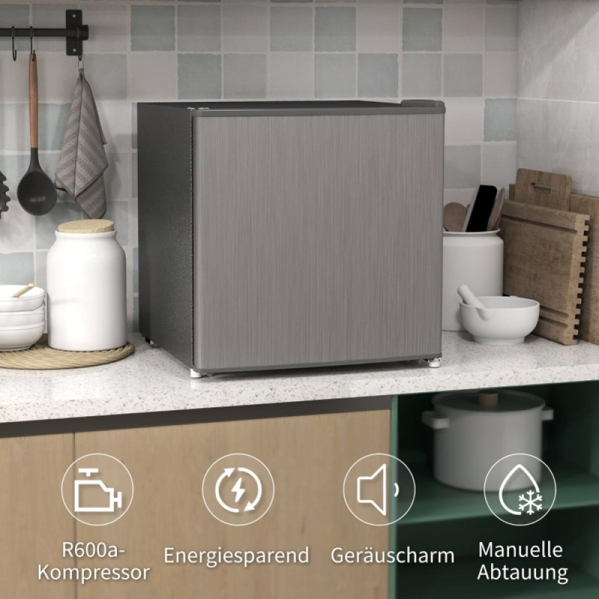 Ein kleiner grauer Kühlschrank auf einer Küchentheke mit Küchenutensilien und Funktionssymbolen.