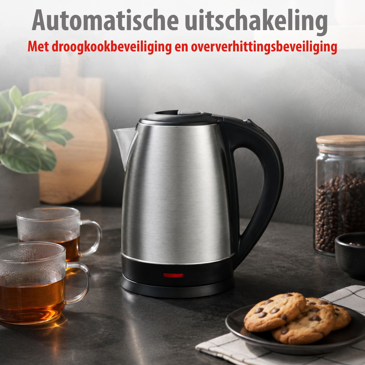 A silver electric kettle on a counter next to tea cups and cookies.