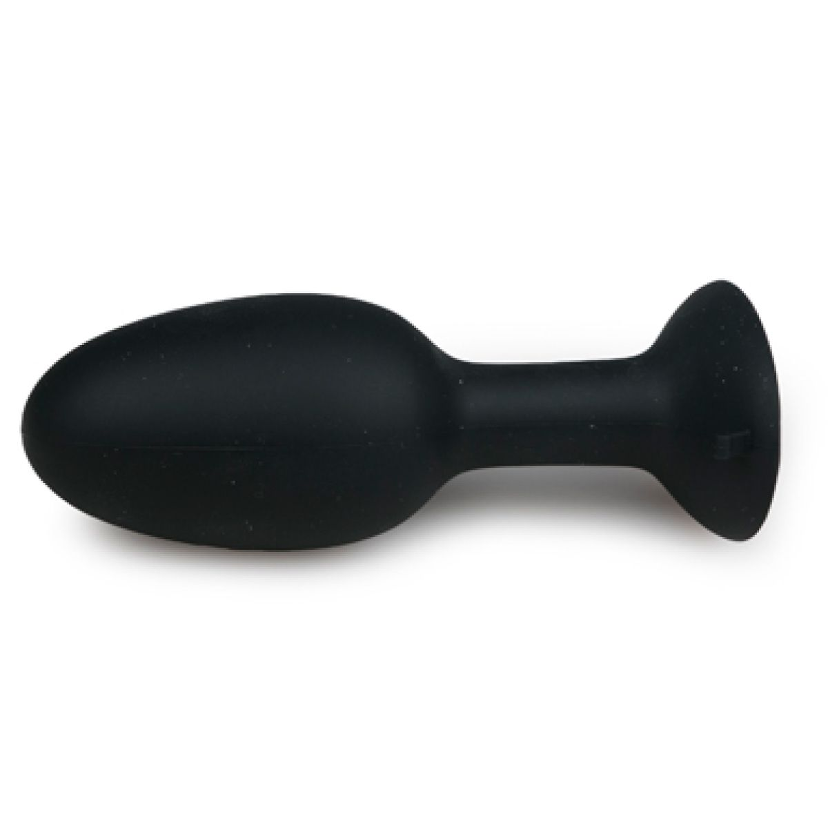 Ein glattes, schwarzes Wellness-Accessoire aus Silikon mit einem breiten Sockel vor weißem Hintergrund.