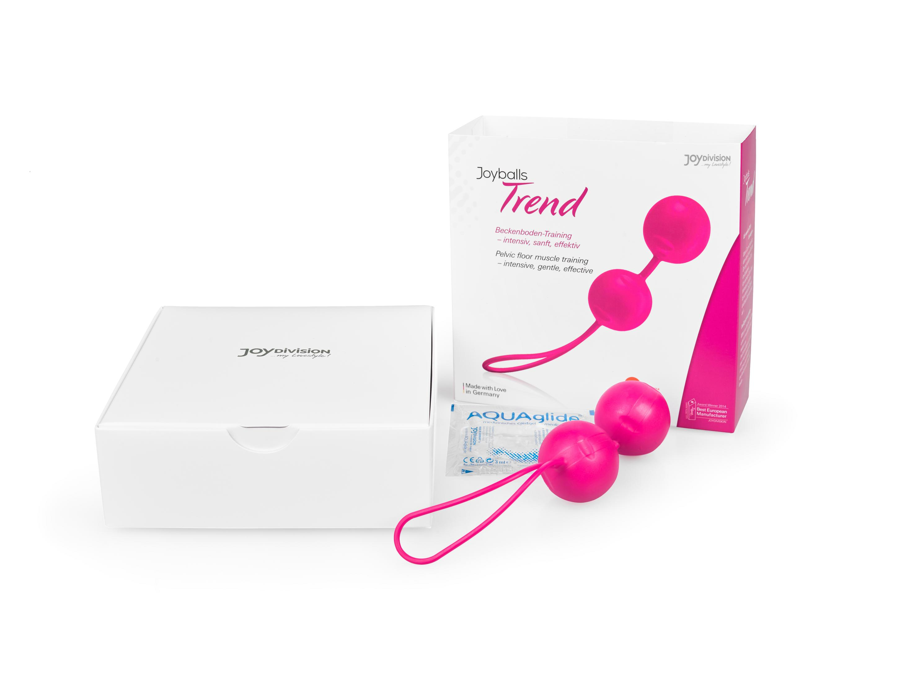 Rosa Joyballs Trend Beckenboden-Training Kugeln neben ihrer Produktverpackung und einer Schachtel.