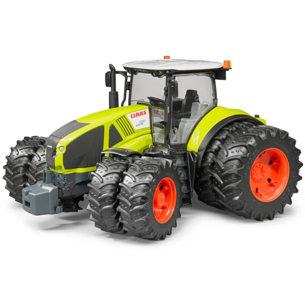 Ein Claas-Spielzeugtraktor in Gelbgrün und Schwarz mit roten Felgen und Zwillingsbereifung vorne und hinten.