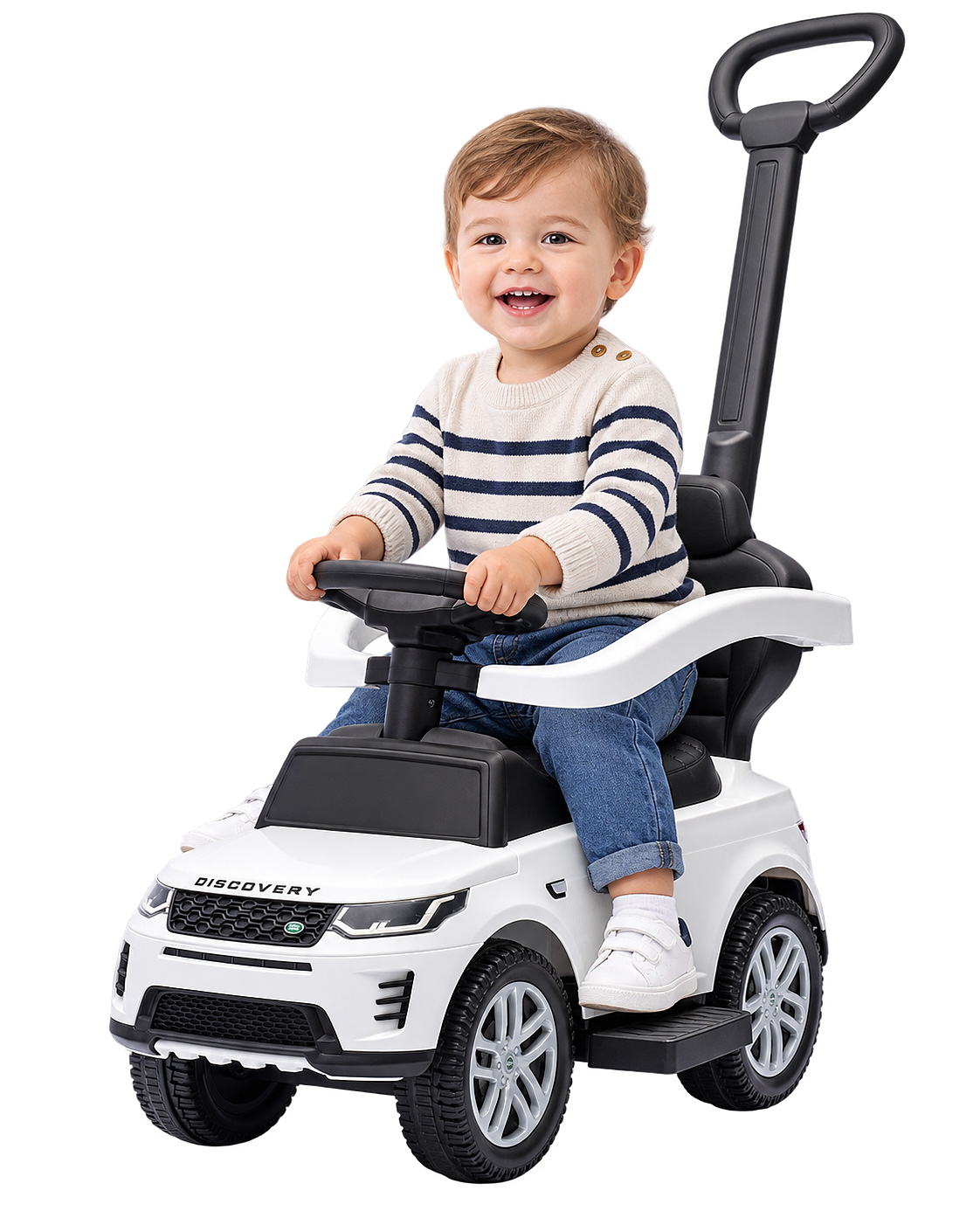 Kleinkind lächelt beim Fahren auf einem weißen Discovery-Spielzeugauto mit Schiebestange.