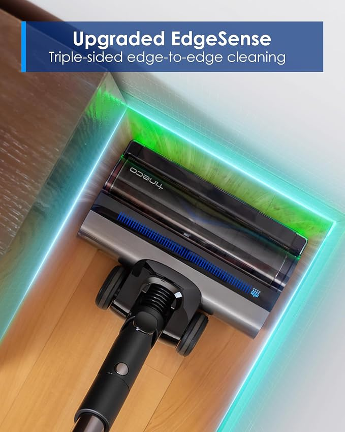Tête d'aspirateur nettoyant près des coins et des murs avec lumière verte.