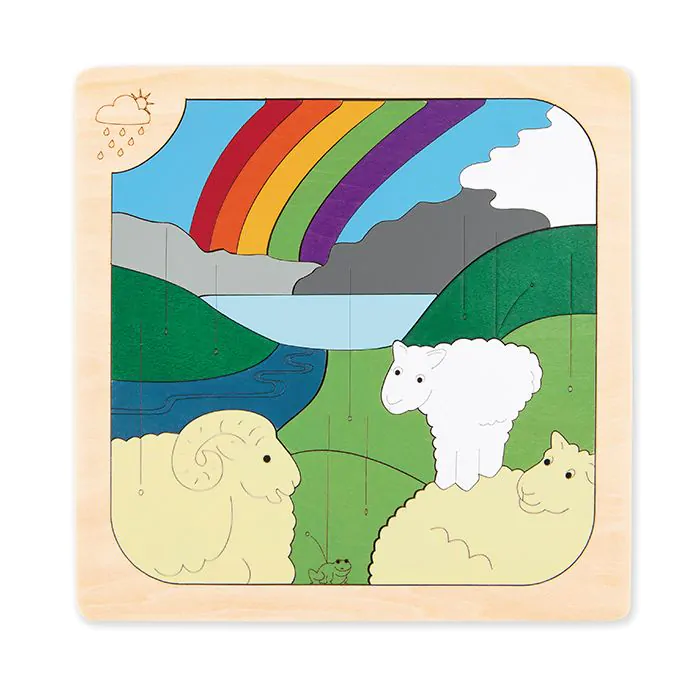 Rompecabezas de madera con tres ovejas, una rana, montañas, río y un arco iris.