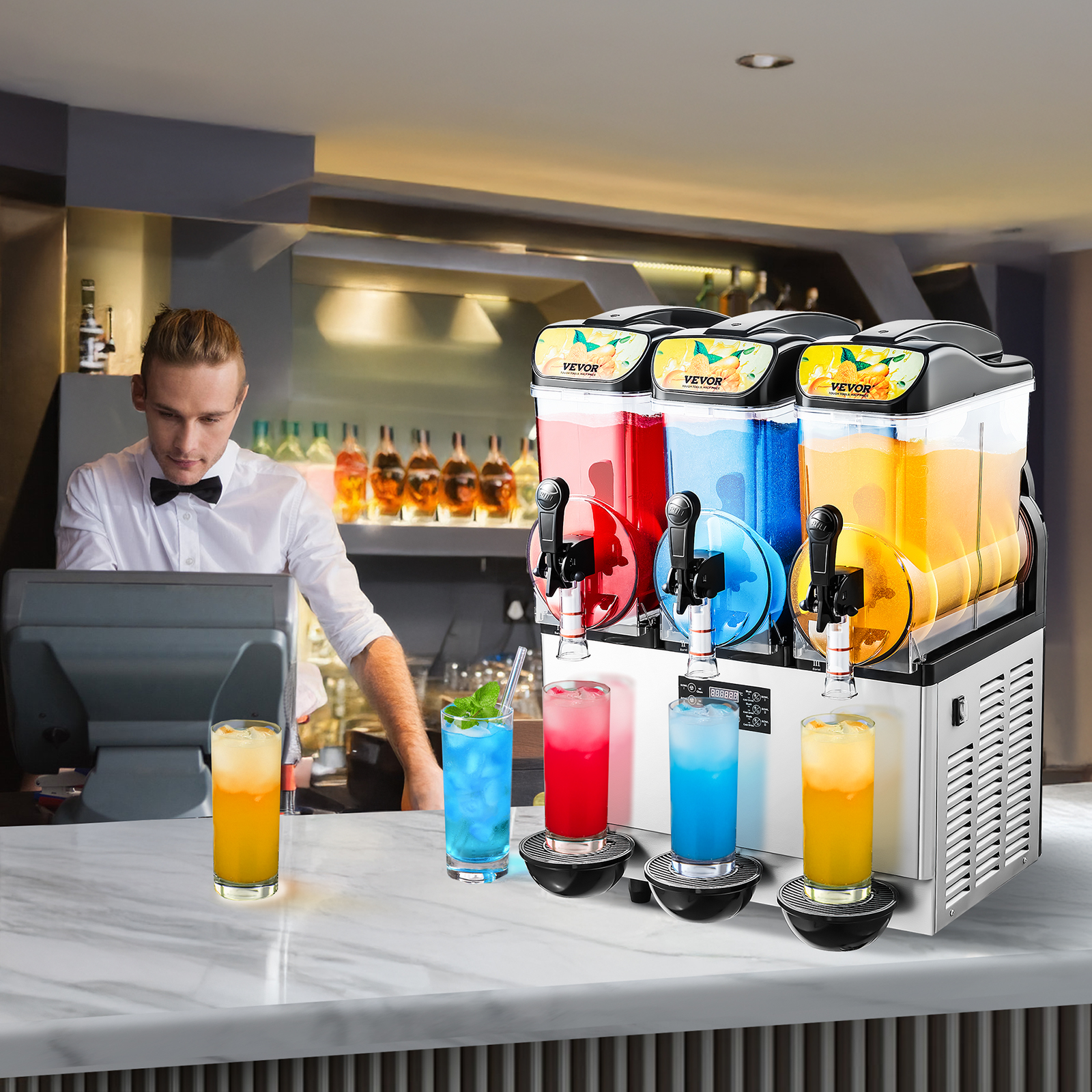 Una máquina de granizados triple sobre la barra con bebidas coloridas y un camarero al fondo.