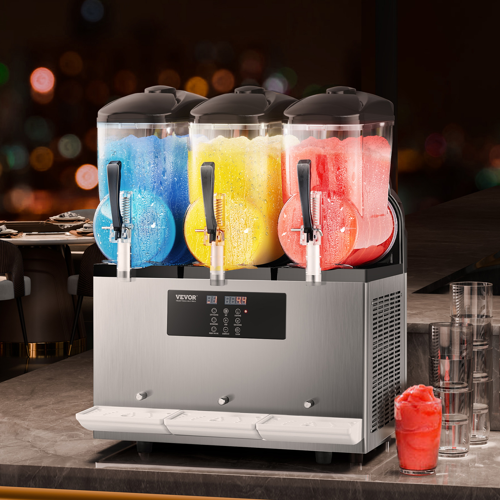 Una máquina de granizados de acero inoxidable con tres tanques con granizado azul, amarillo y rojo.