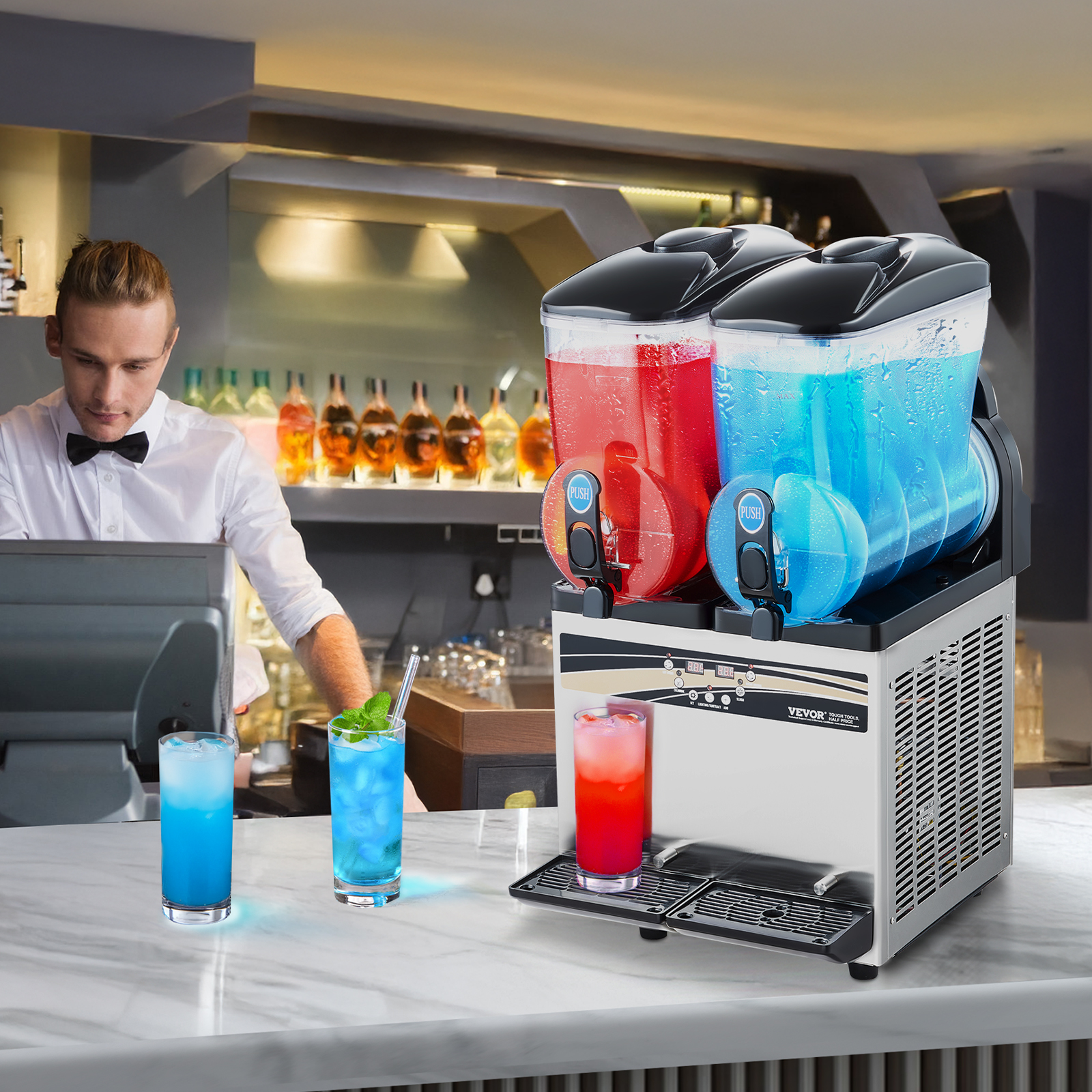 Máquina de granizados doble con bebidas rojas y azules en una barra, con un camarero al fondo.