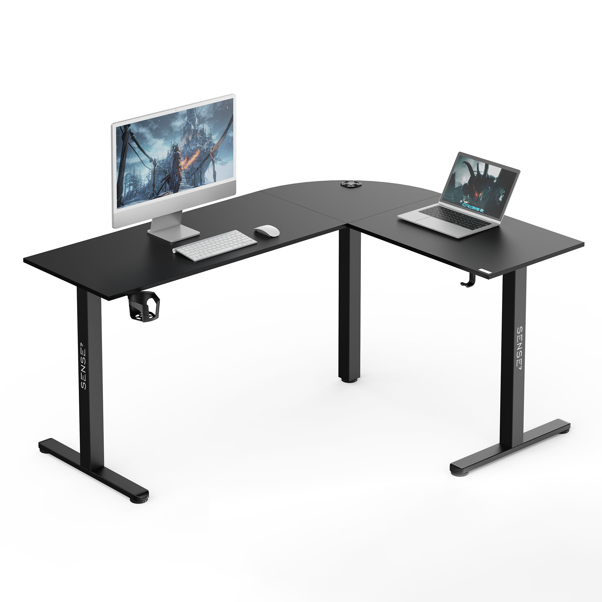Black L-shaped computer desk with a white monitor, keyboard, mouse, and a laptop on a white background.