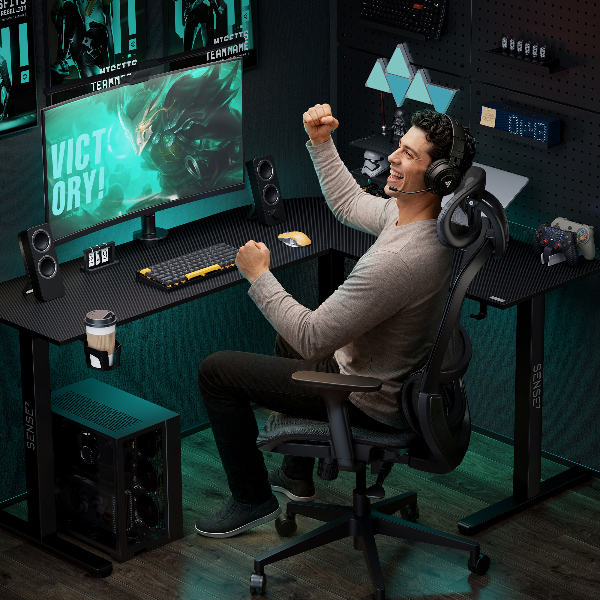 A gamer celebrates victory at his desk with monitors, PC, and headset in a dark gaming room.
