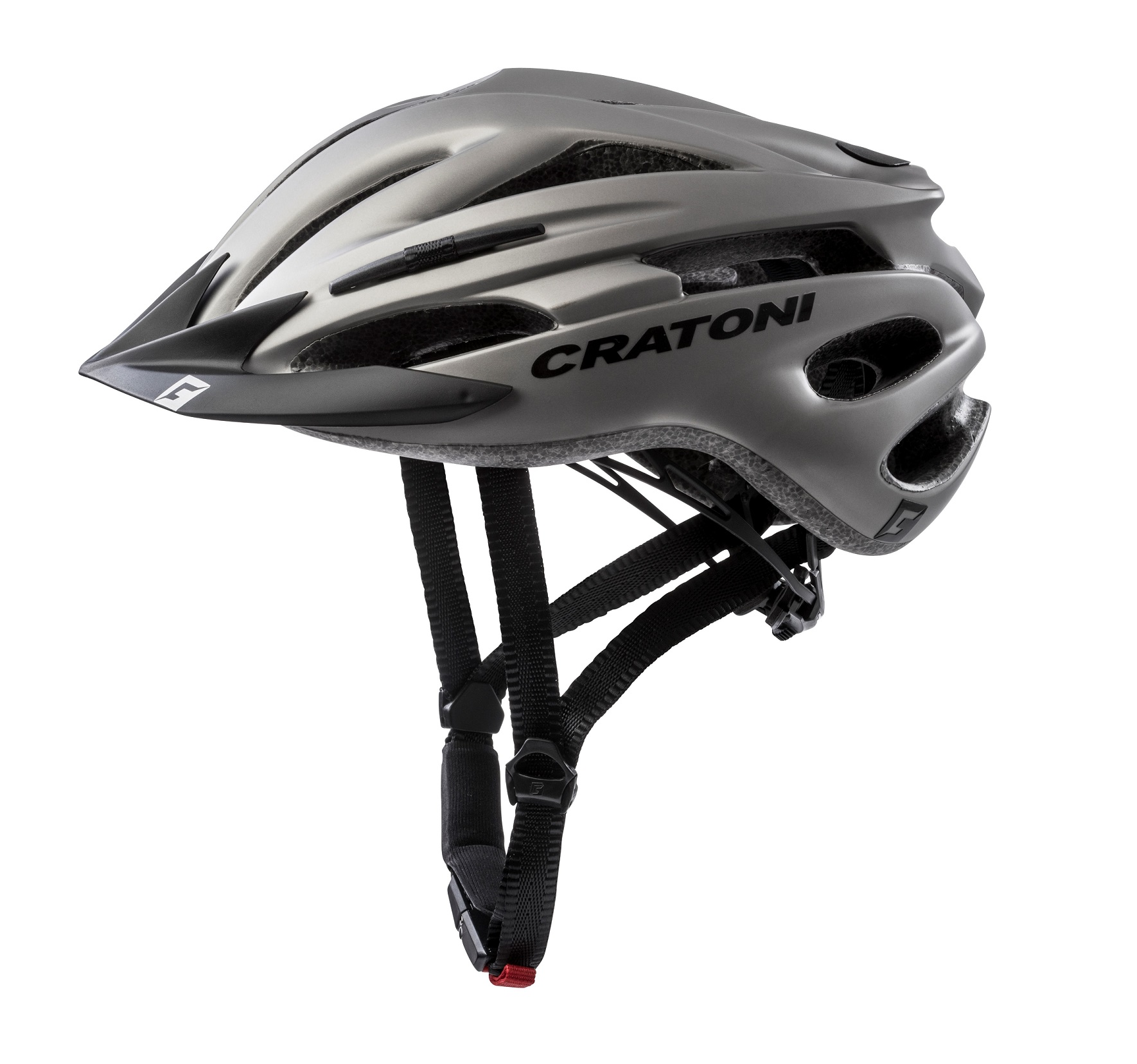 Ein silberner Cratoni-Fahrradhelm mit schwarzen Riemen und einem Visier, im Seitenprofil vor weißem Hintergrund.