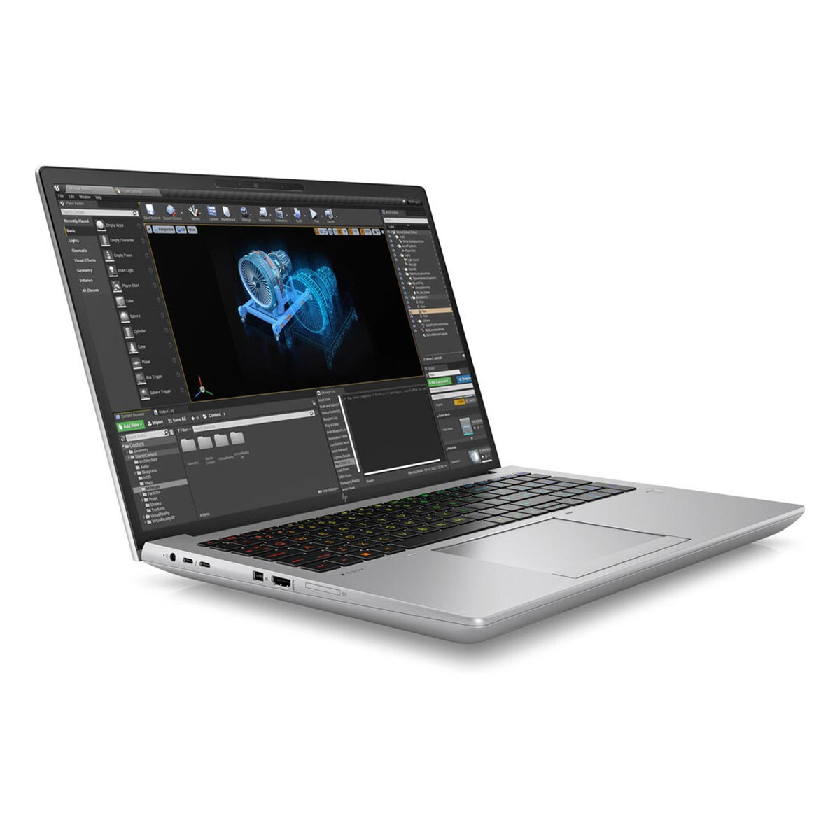 Srebrny laptop z oprogramowaniem do projektowania 3D na ekranie stoi na białej powierzchni.