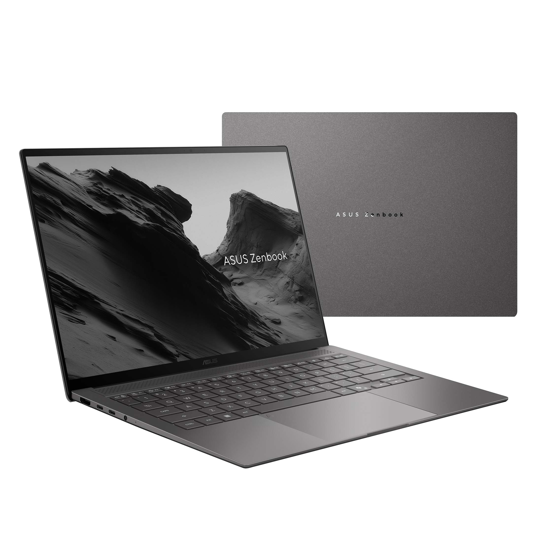 Ein grauer Asus Zenbook Laptop mit offenem Bildschirm zeigt eine Berglandschaft, die geschlossene Hülle ist im Hintergrund.