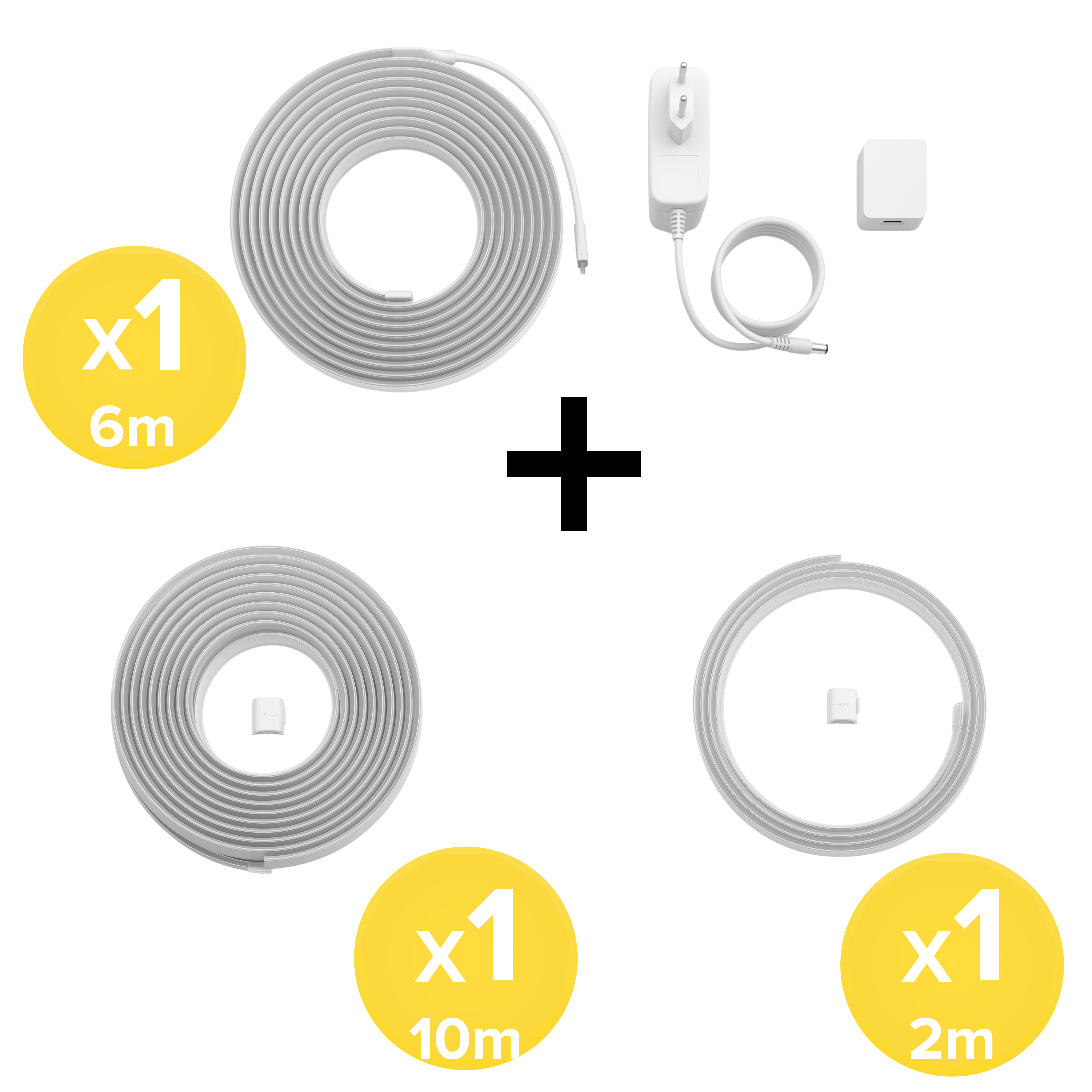 Un set di tre strisce LED bianche da 6m, 10m e 2m, con alimentatore e accessori su sfondo bianco.