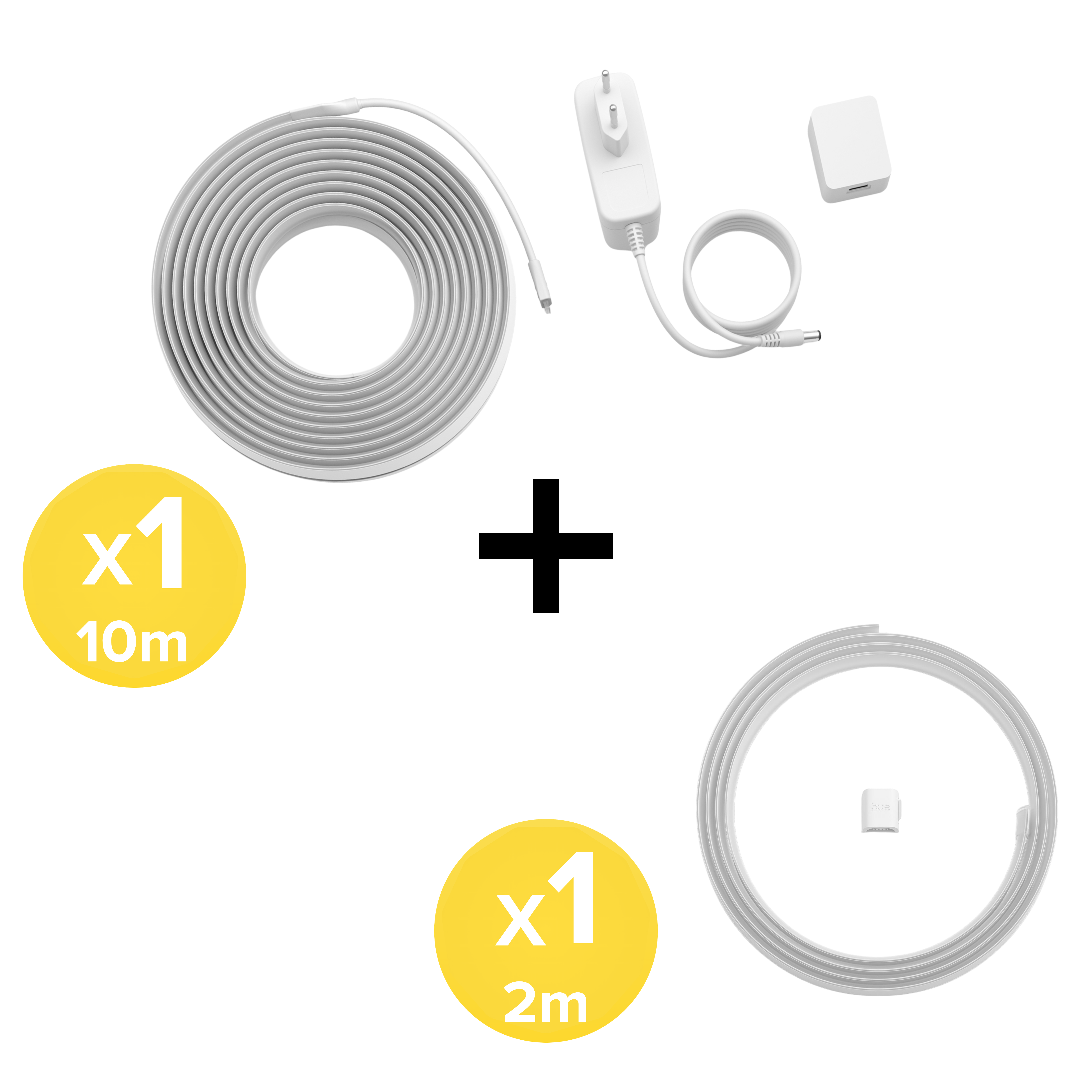 Una striscia LED da 10m, una da 2m, un alimentatore e prese su sfondo bianco.