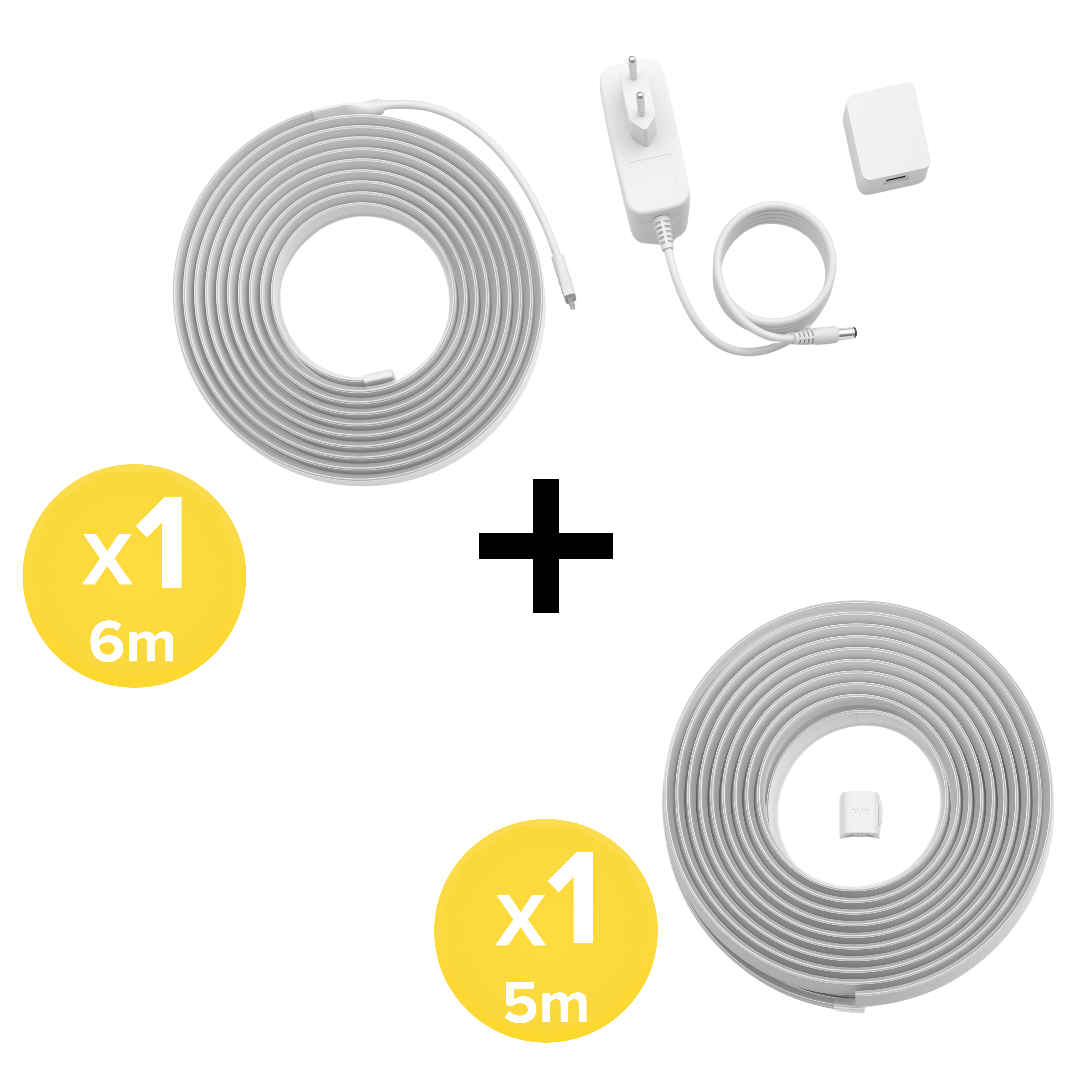 Strisce LED bianche da 6m e 5m, alimentatore e spina su sfondo bianco.
