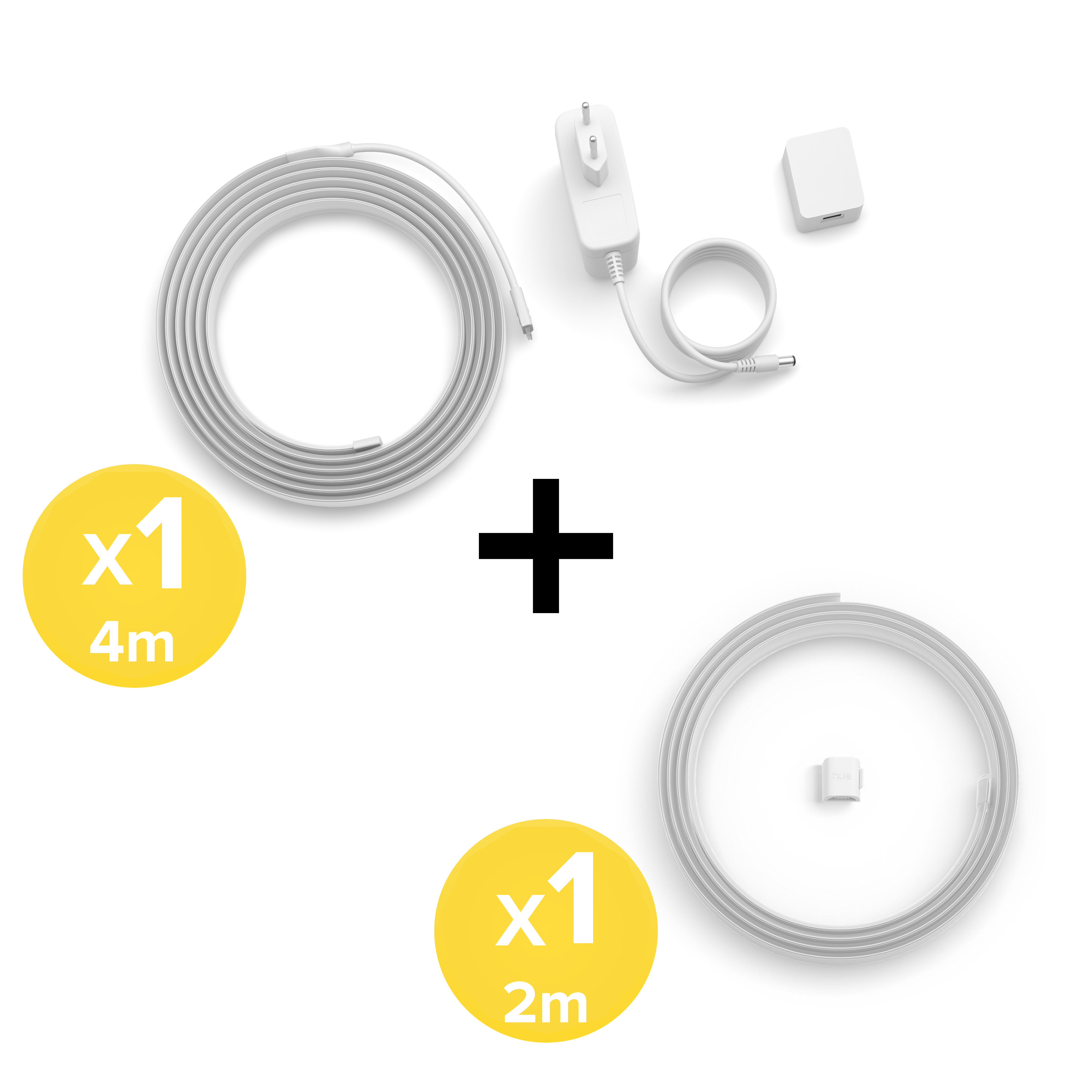 Unastriscia LED bianca da 4m e una da 2m con alimentatore e accessori su sfondo bianco.