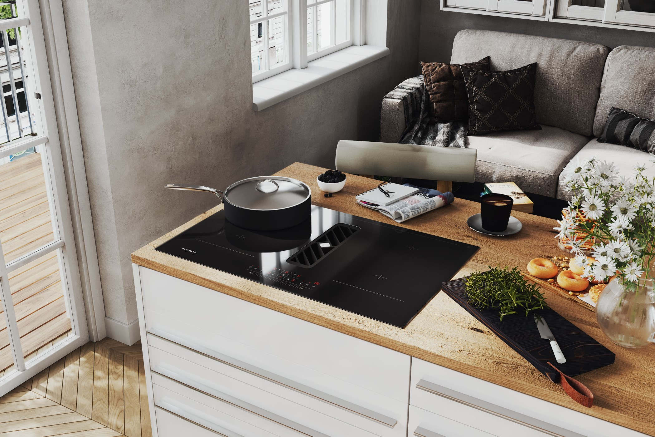 Moderne Küche mit Kochfeld, Topf, Blumen und gemütlichem Sofa im Hintergrund.