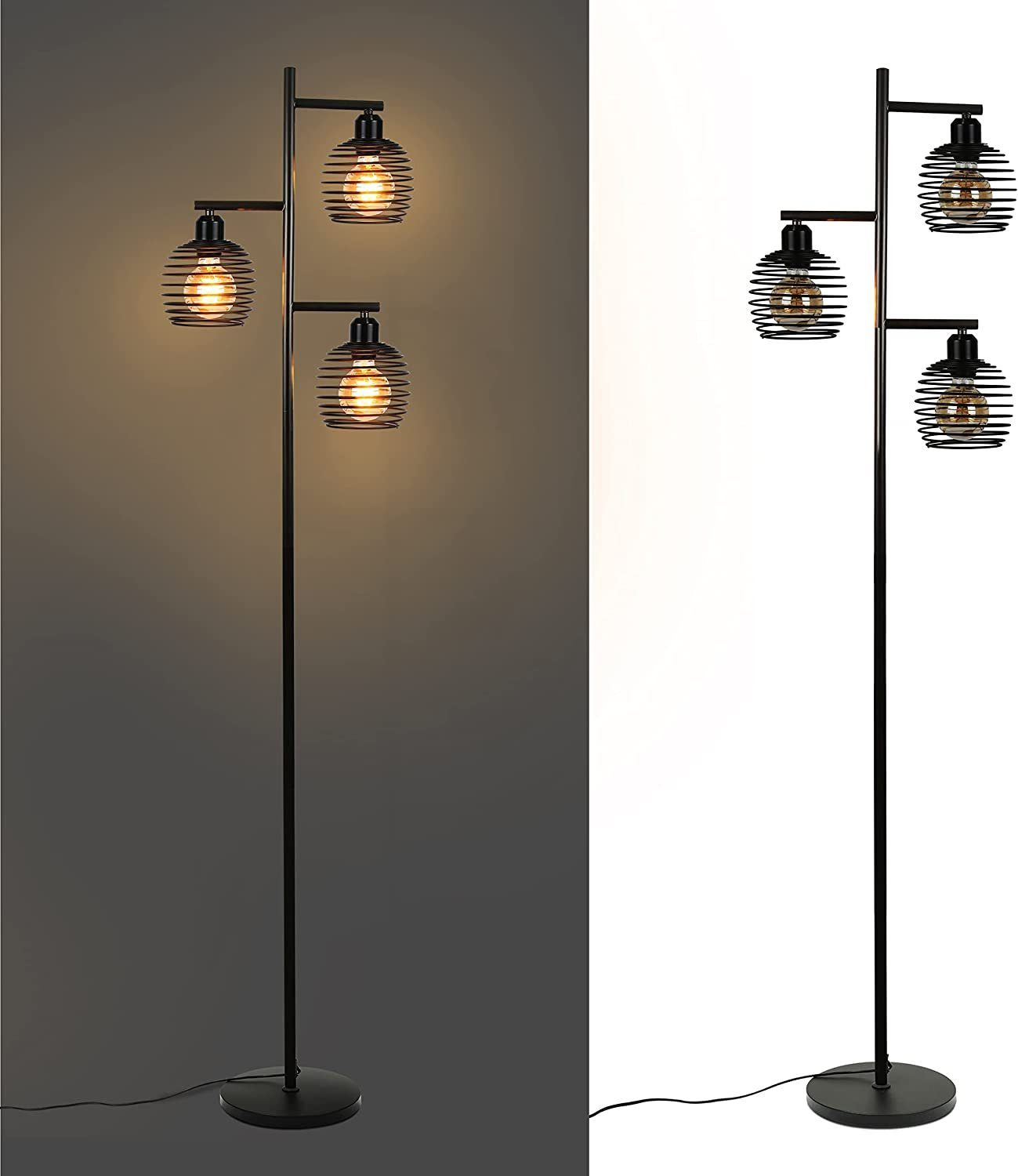 Eine schwarze Stehlampe aus Metall mit drei käfigartigen Schirmen und glühenden Glühbirnen vor hellem und dunklem Hintergrund.