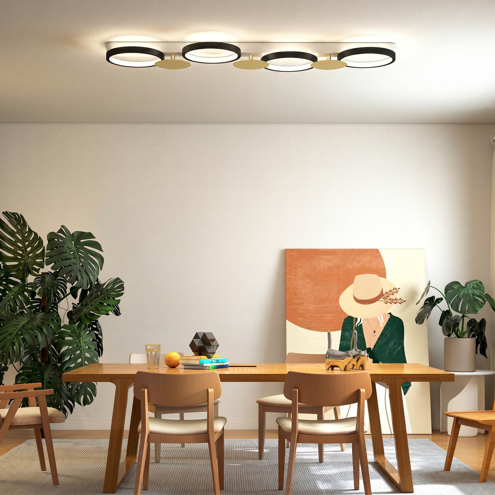 Lámpara de techo moderna sobre una mesa de madera con plantas, libros y arte en una habitación minimalista.