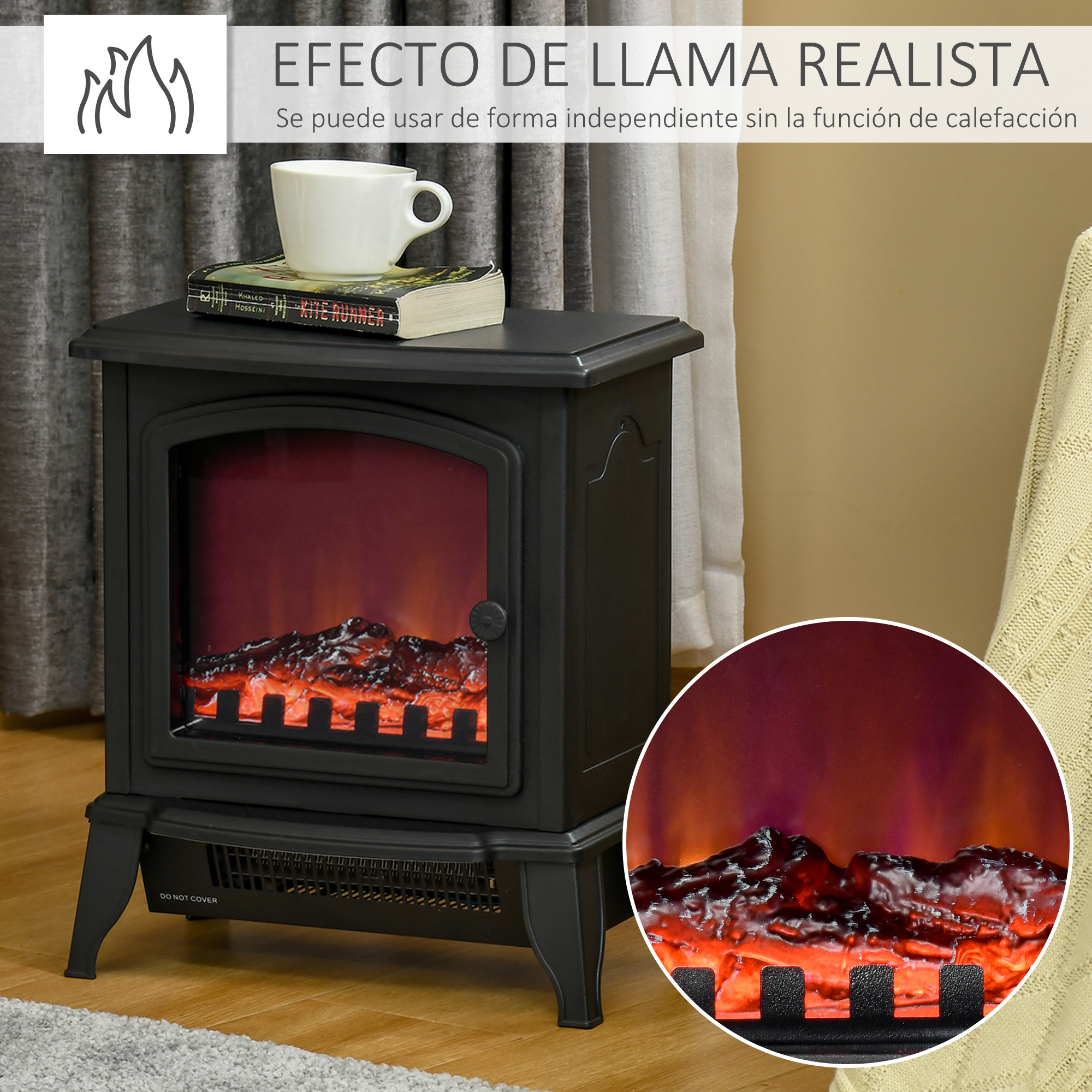 Una estufa eléctrica negra con llamas realistas, con un libro y una taza blanca encima.