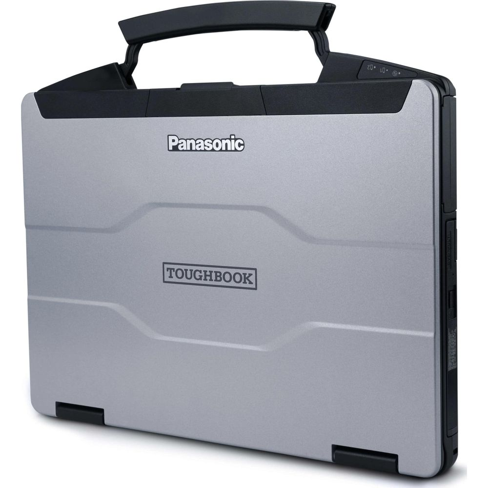 Un ordinateur portable Panasonic Toughbook argenté avec une poignée de transport noire robuste sur fond blanc.