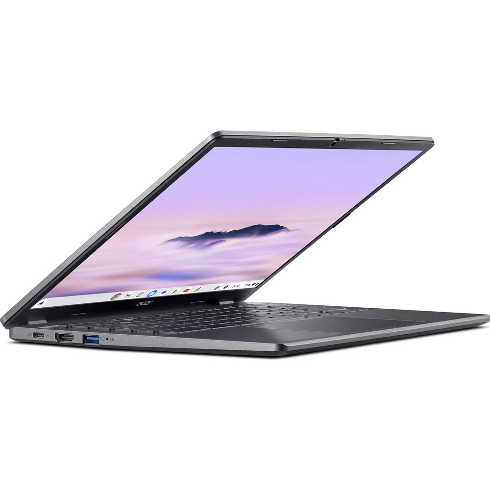 Un computer portatile grigio con schermo aperto mostra un murale di montagna e porte laterali visibili.