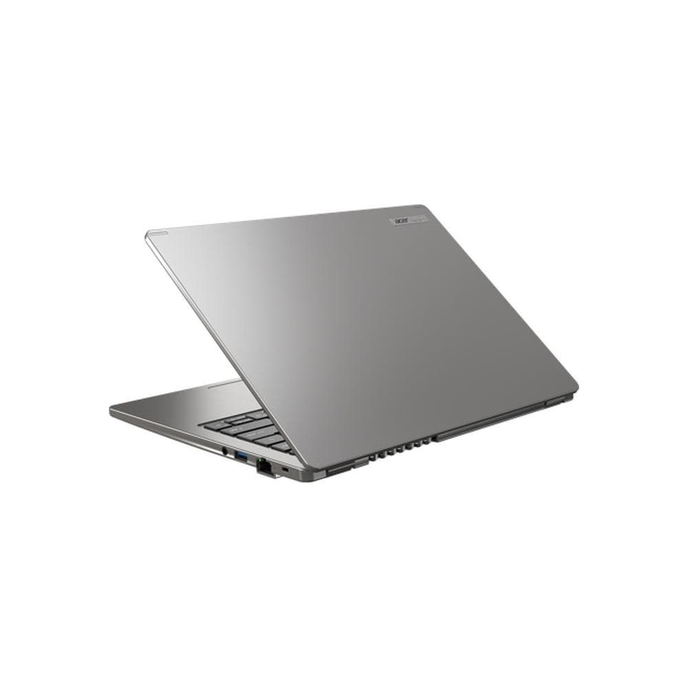 Un ordinateur portable Acer argenté avec le couvercle fermé sur une surface blanche.