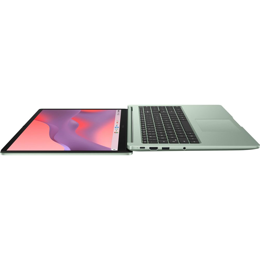 Un ordinateur portable vert ouvert est posé à plat sur une surface blanche, montrant le clavier et l'écran coloré.