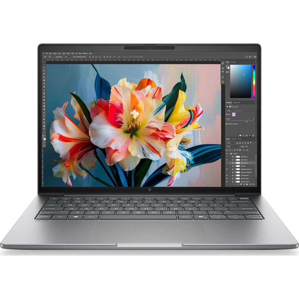 Un computer portatile argentato mostra un'immagine floreale colorata in un programma di design.